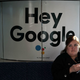A woman sits in a Las Vegas Monorail car with a Google ad prior to the CES 2018.